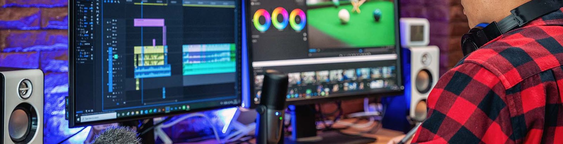 The man makes video editing. Video production. Color Correction. Sound editing. Film making. The work of a freelancer. Equipment filmmaking. Create videos. Program for video editing.